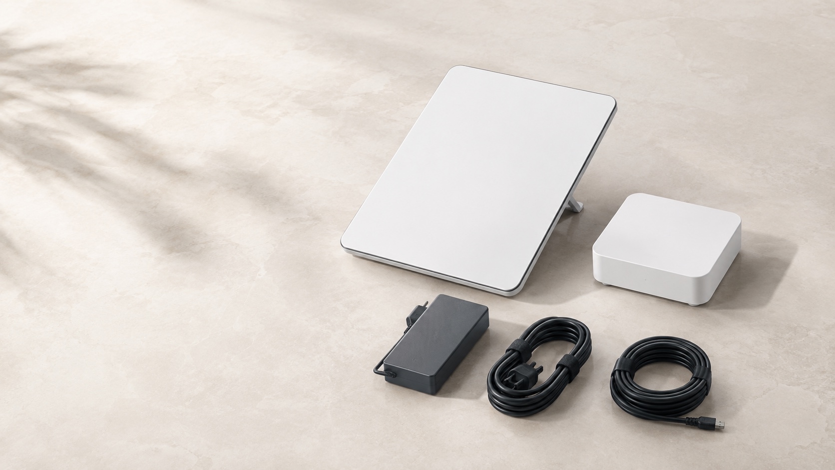 Satellite terminal, Wi-Fi router, power supply and cables arranged as a complete hardware kit